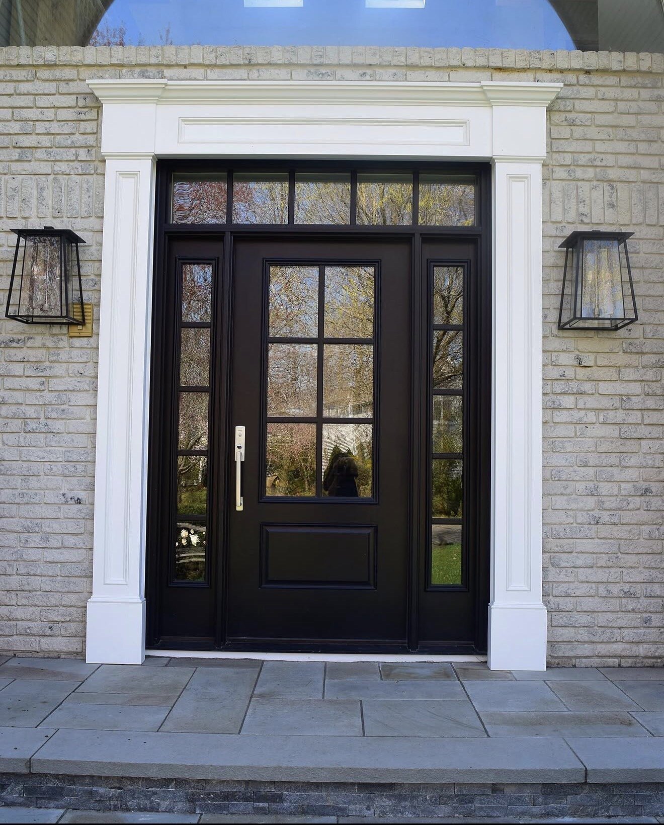 Refined black front door installation by Rufino Carpentry