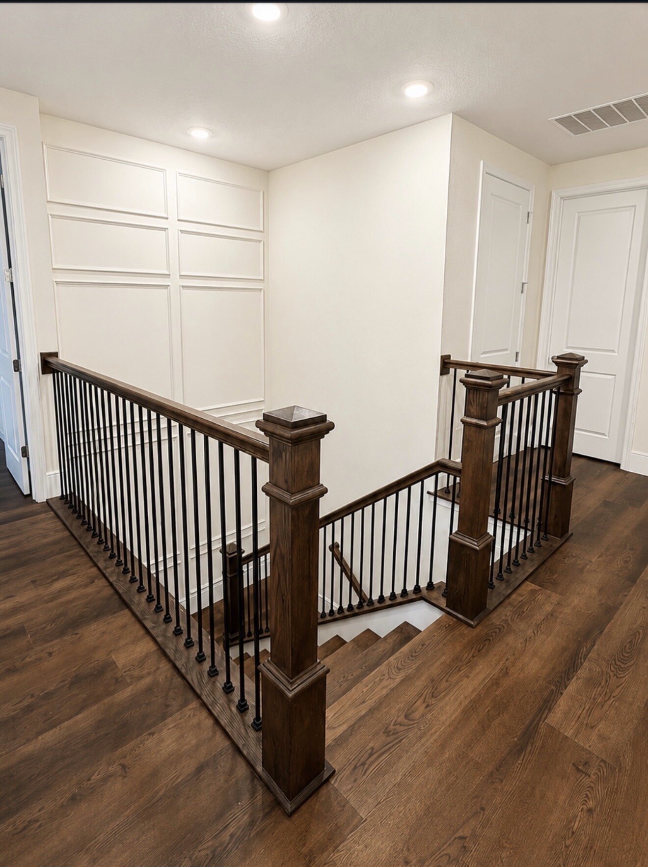 Wood handrail and newel posts installed by Rufino Carpentry
